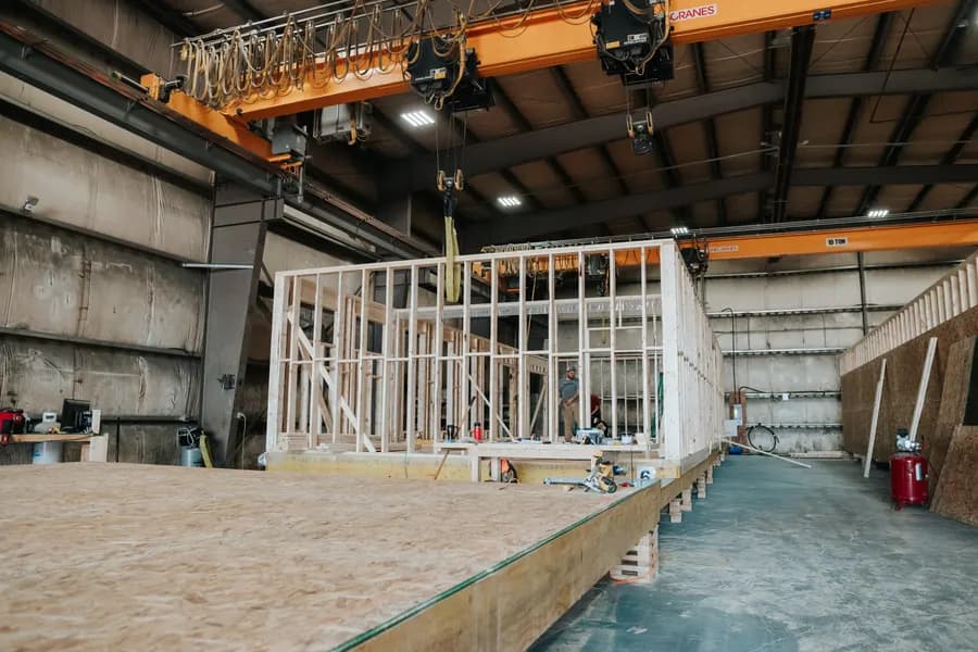 A framed Herauf module under the plant's ten-tonne gantry crane, ready to be lifted off the deck