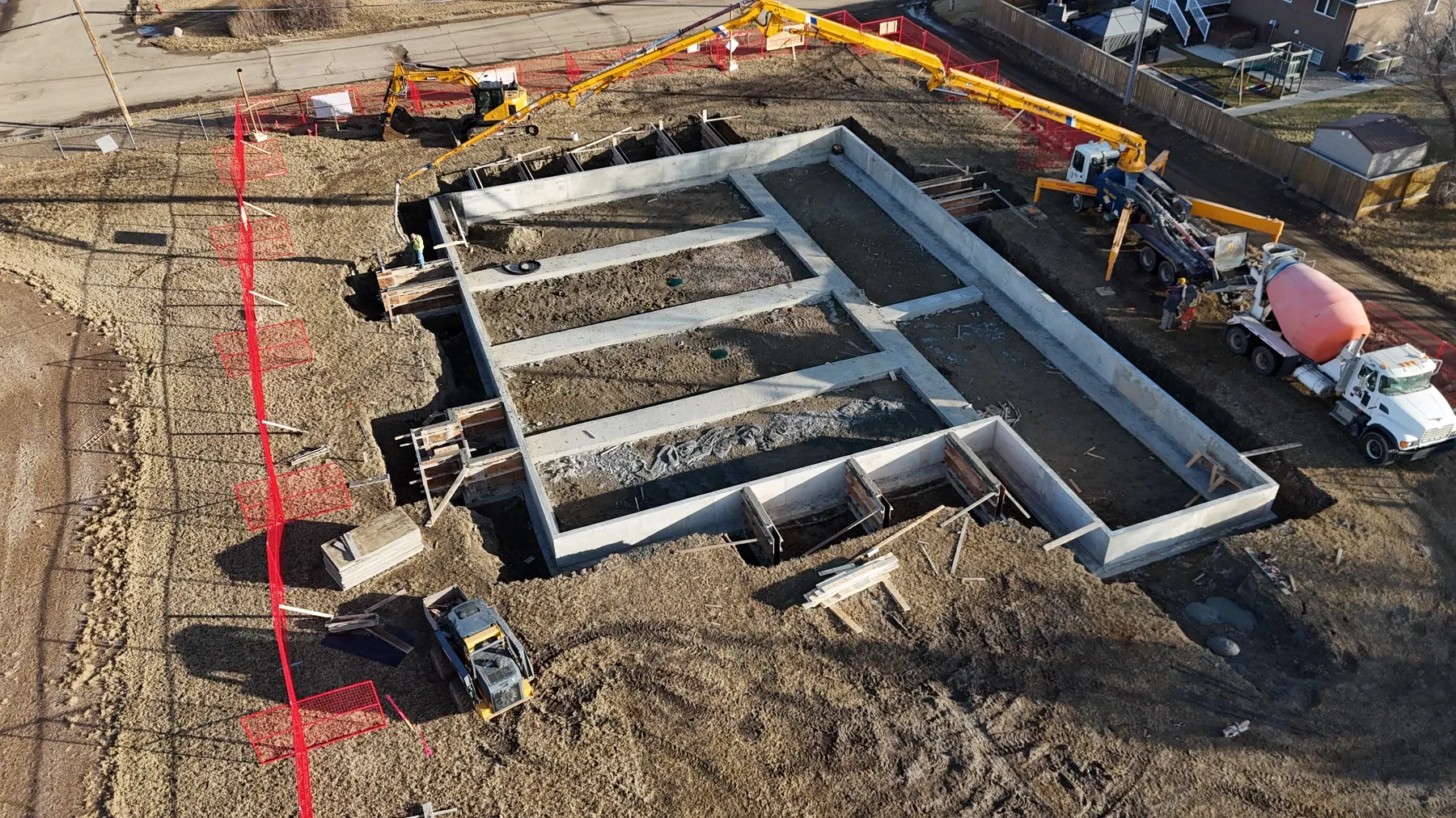 Winter aerial view of foundations prepared for modular units