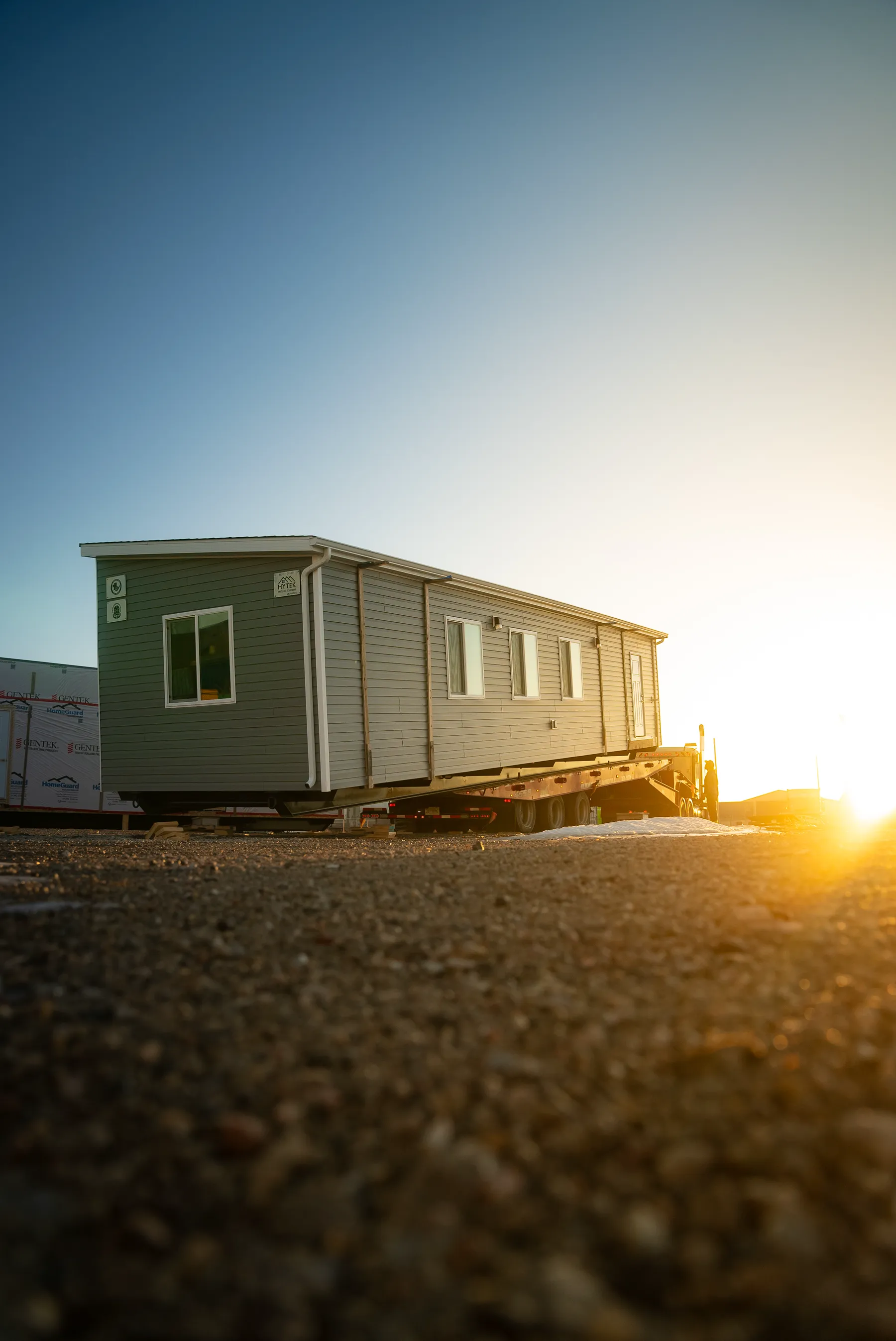 A finished Herauf modular home on site at golden hour