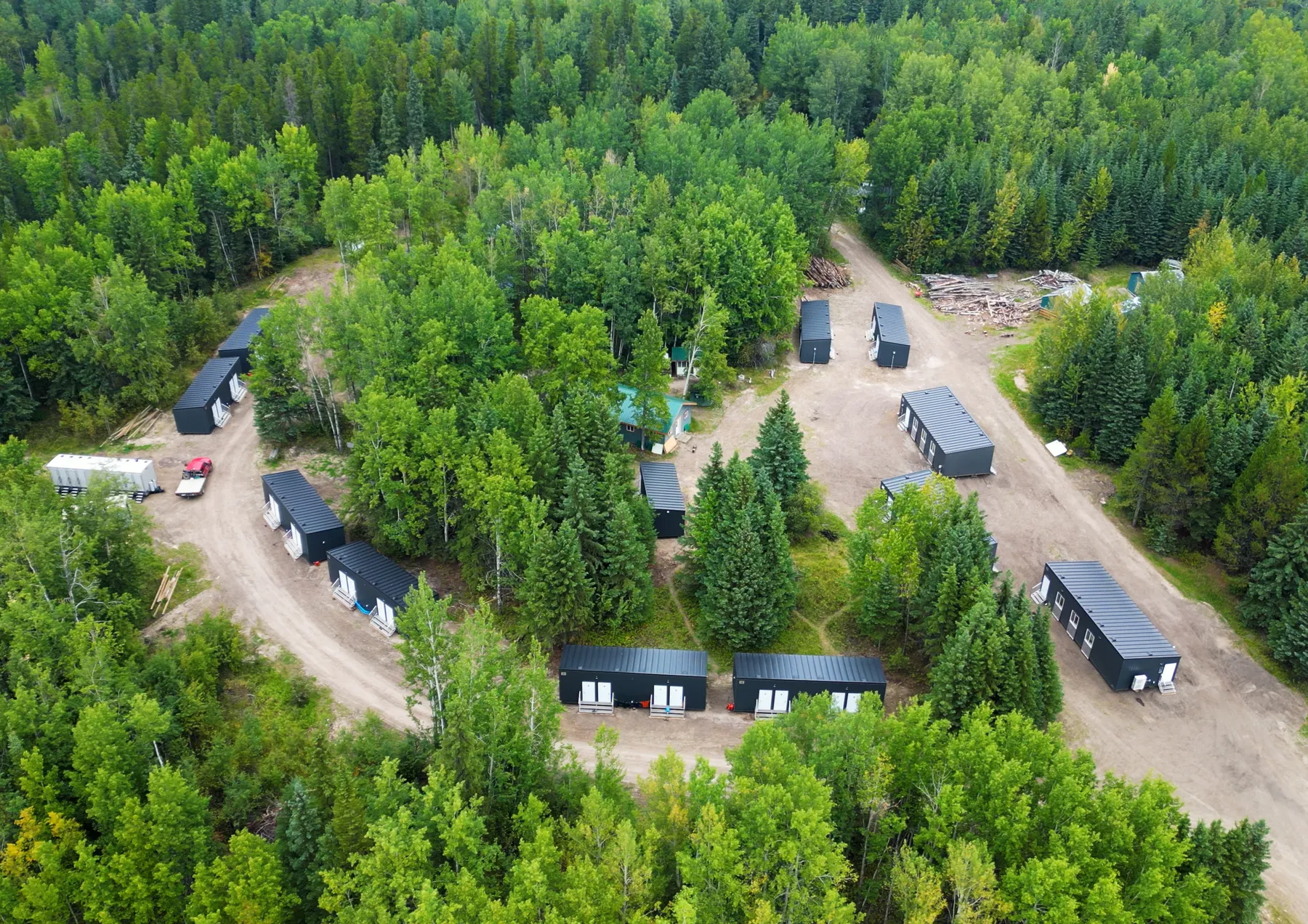 Aerial view of a Herauf modular camp among northern forest