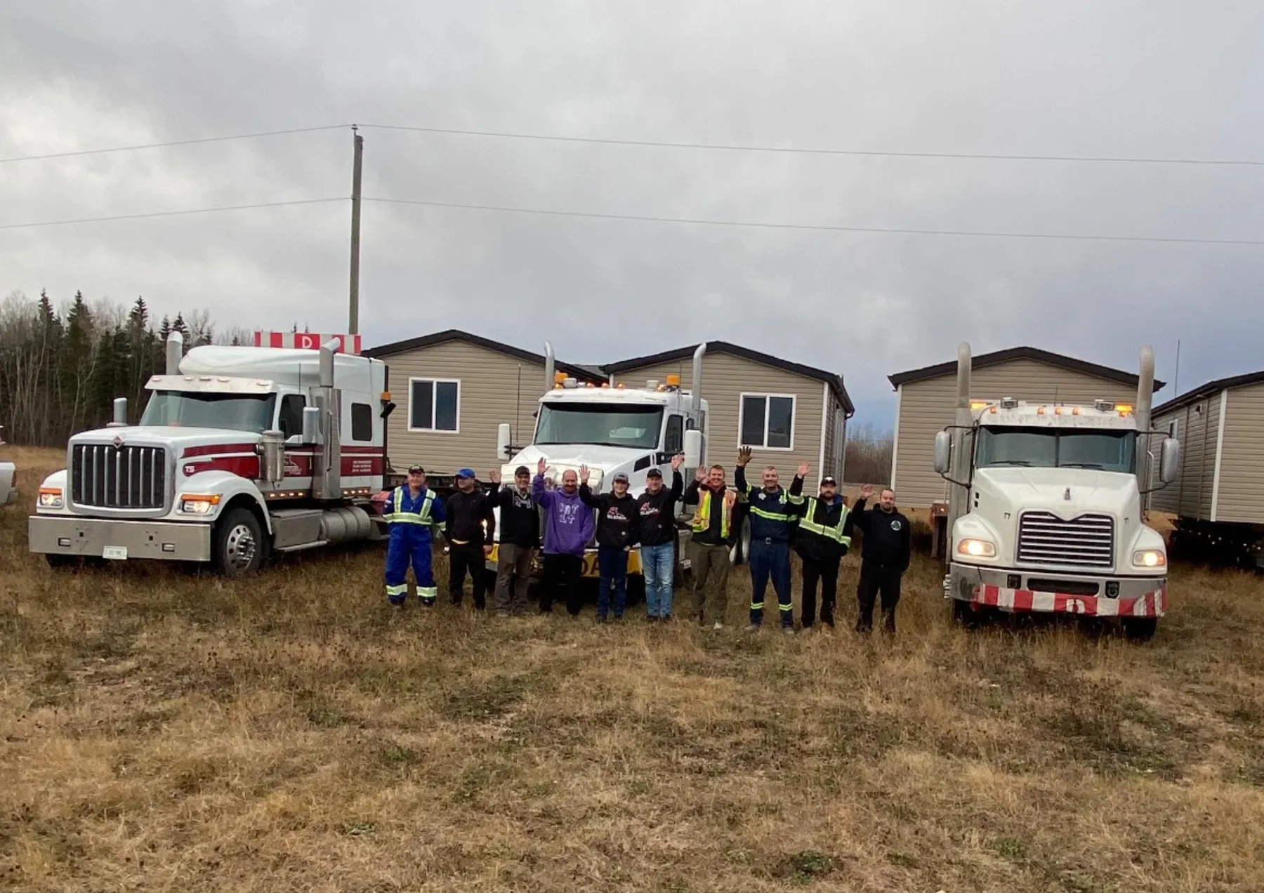 The Herauf team with two loaded trucks before a delivery run