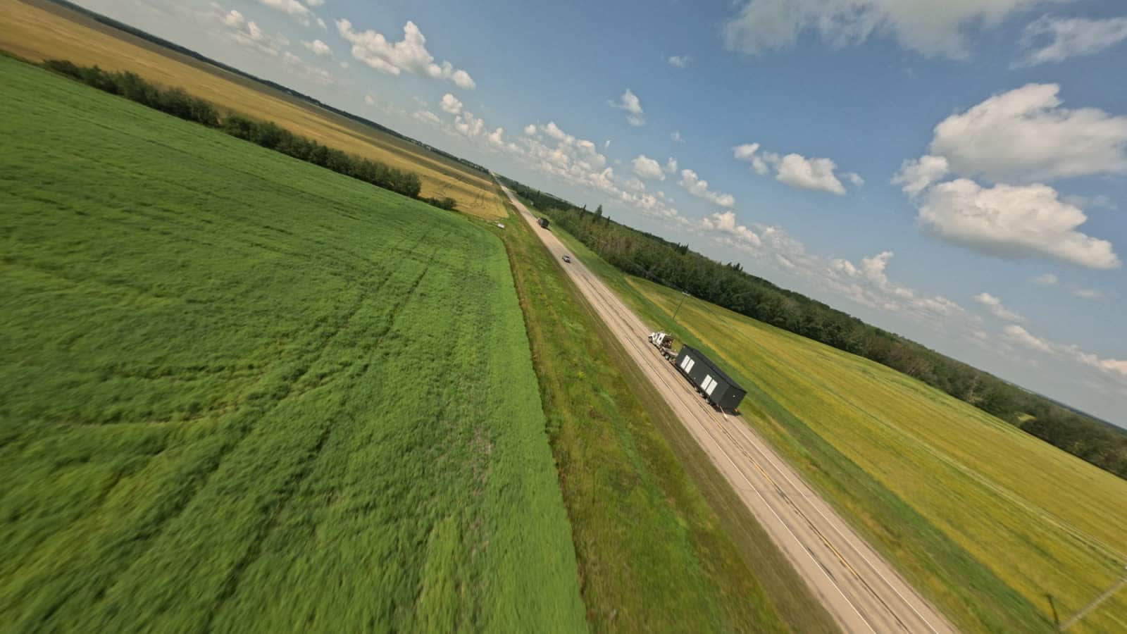 A Herauf module crossing the prairie to its site