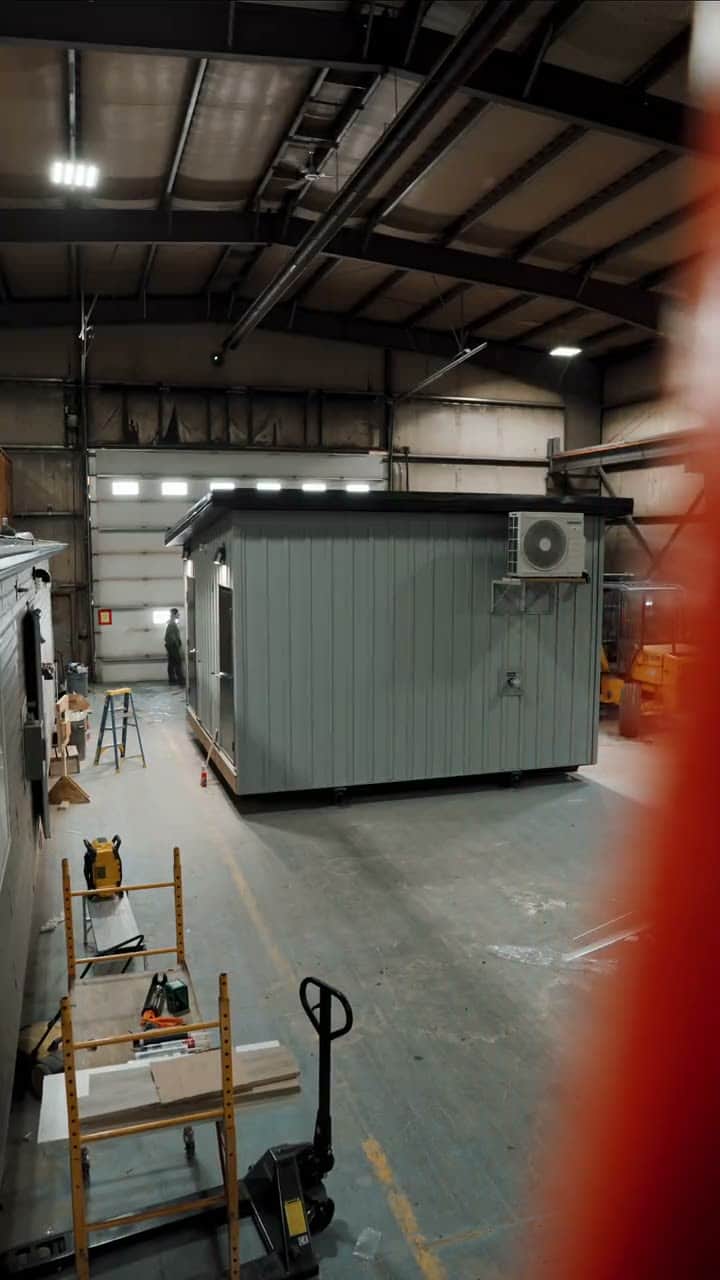 A finished modular washroom building on the plant floor, then set on site
