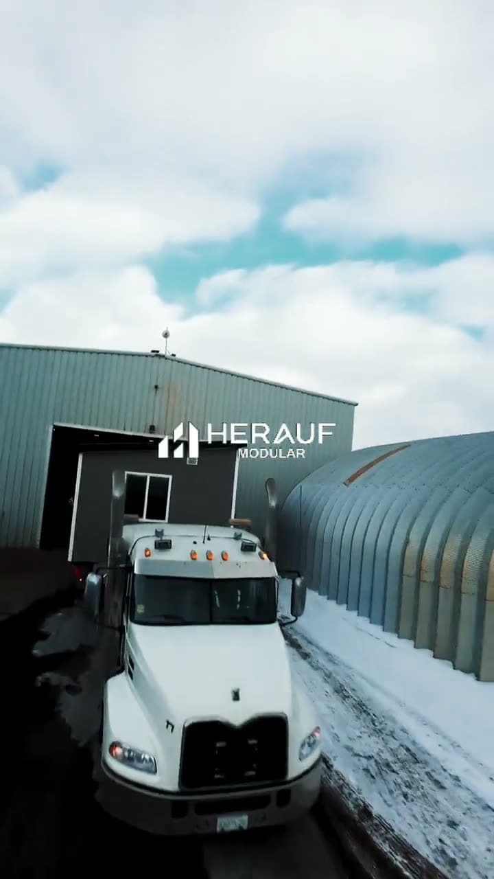 White Herauf truck parked outside the plant in the snow